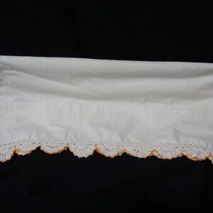 Vintage pillowcases with hand-crocheted trim.